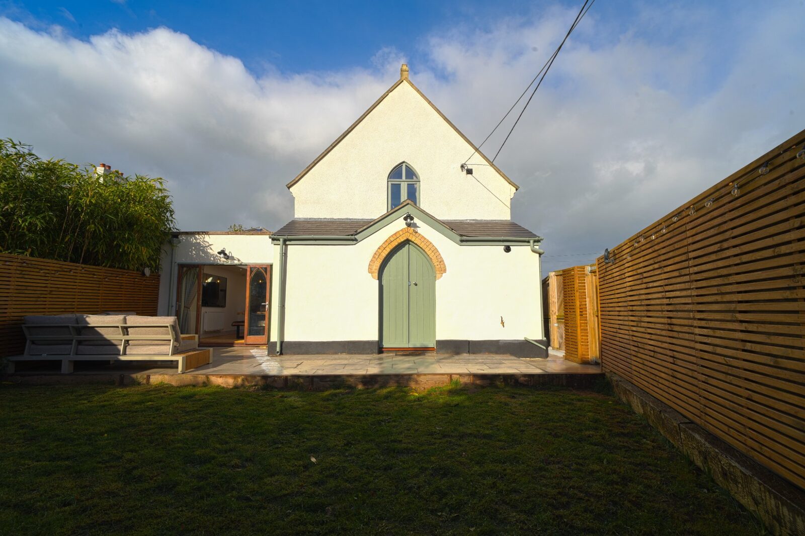 The Old Chapel exterior with Gothic arched door