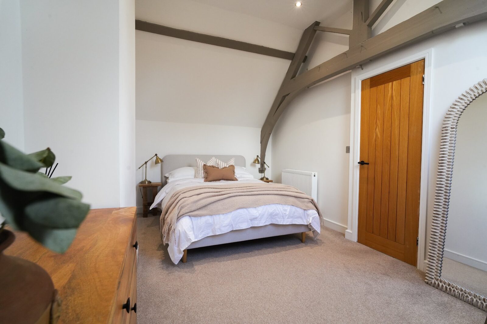 Master bedroom with exposed chapel beams