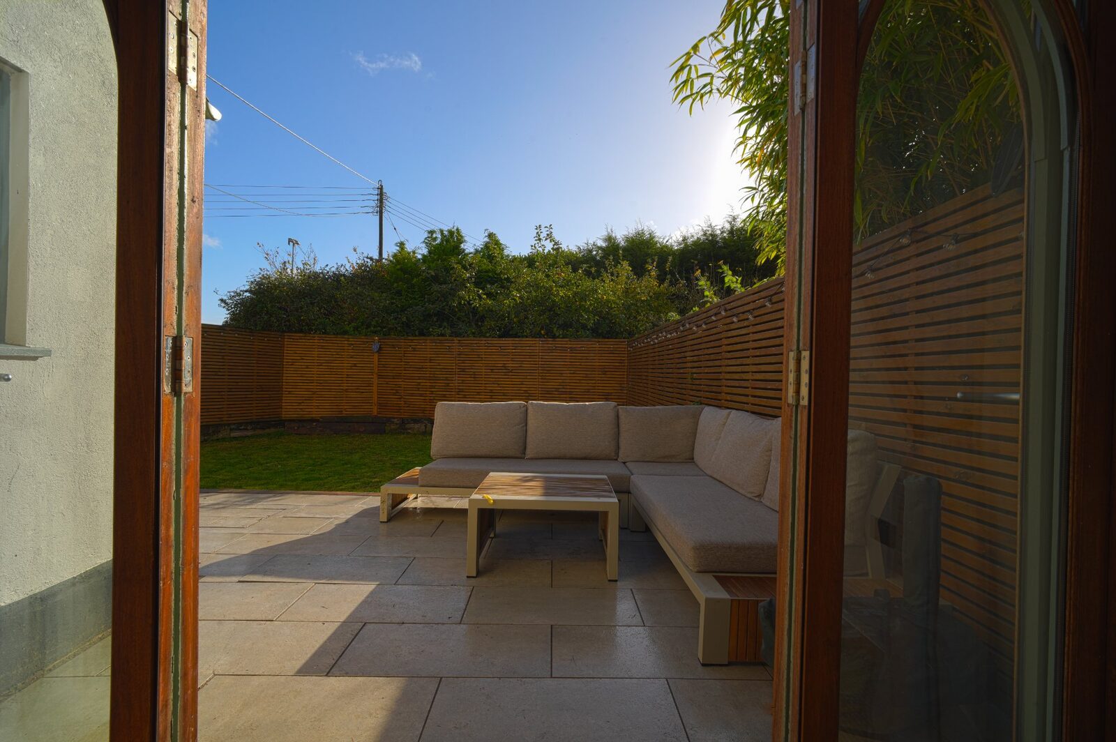 Garden view through Gothic arched doors